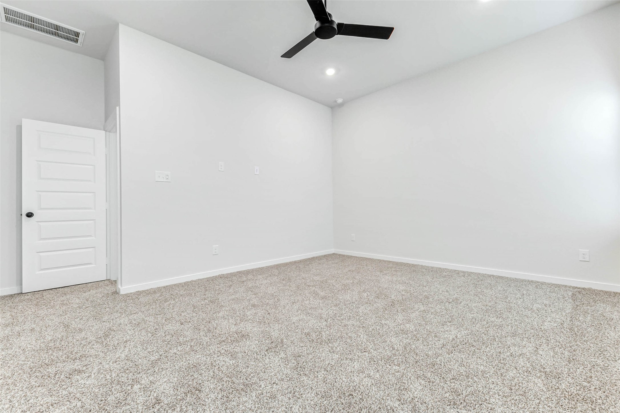 6422 Pomona Court Rosharon, TX 77583 - Photo 9 of 24 an empty room with a ceiling fan and carpet