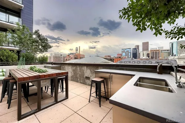 a terrace with a table and chairs