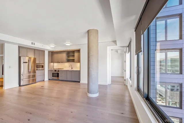 a view of a big room with closet and windows