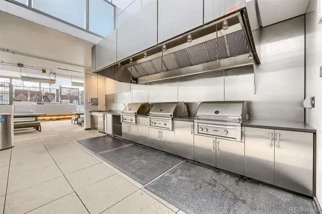 a view of a refrigerator in kitchen and window