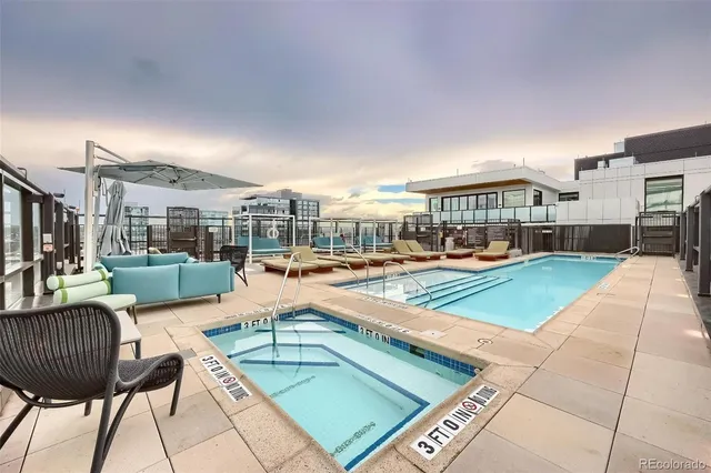 a view of a patio with swimming pool table and chairs