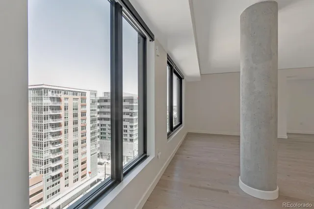 a view of balcony with floor to ceiling window