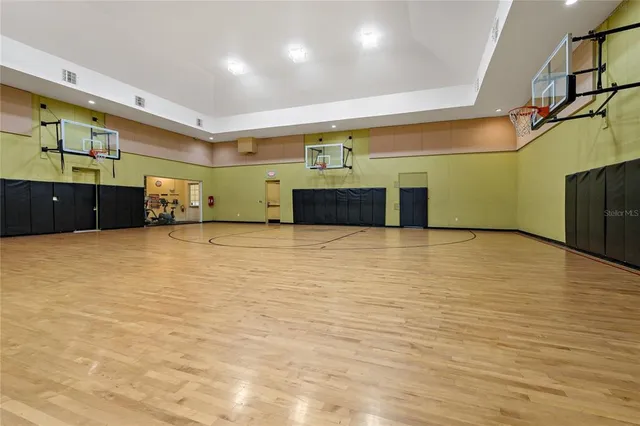 a view of a room with wooden floor