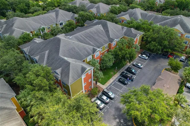 an aerial view of house with yard