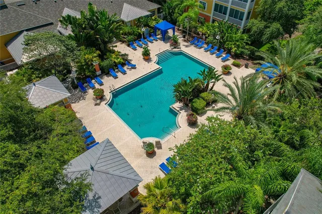 an aerial view of a house with a yard and garden