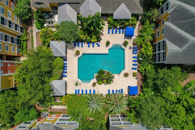 an aerial view of a house with outdoor space and street view