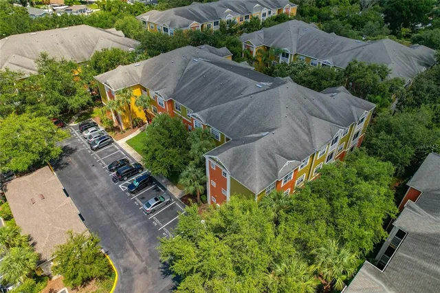 an aerial view of house with yard