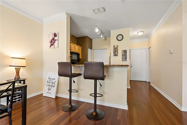 a view of kitchen with furniture and wooden floor