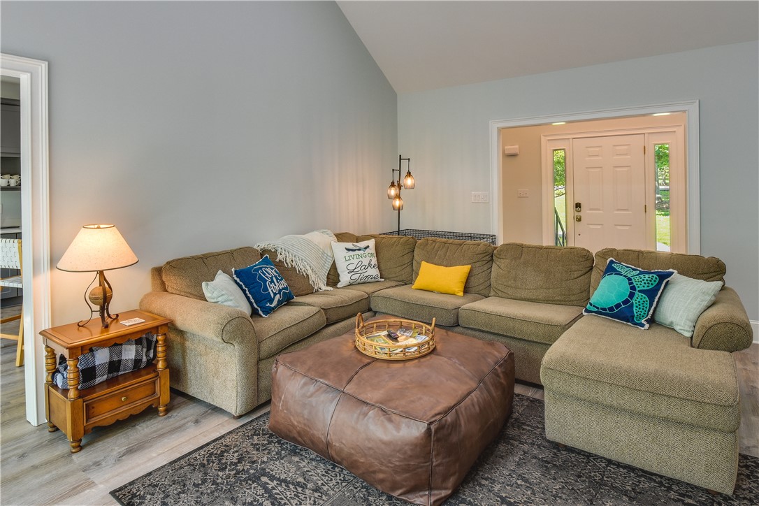 206 Petty Road Seneca, SC 29672 - Photo 17 of 48 Relax in this comfortable living area, complete with a vaulted ceiling and durable flooring.