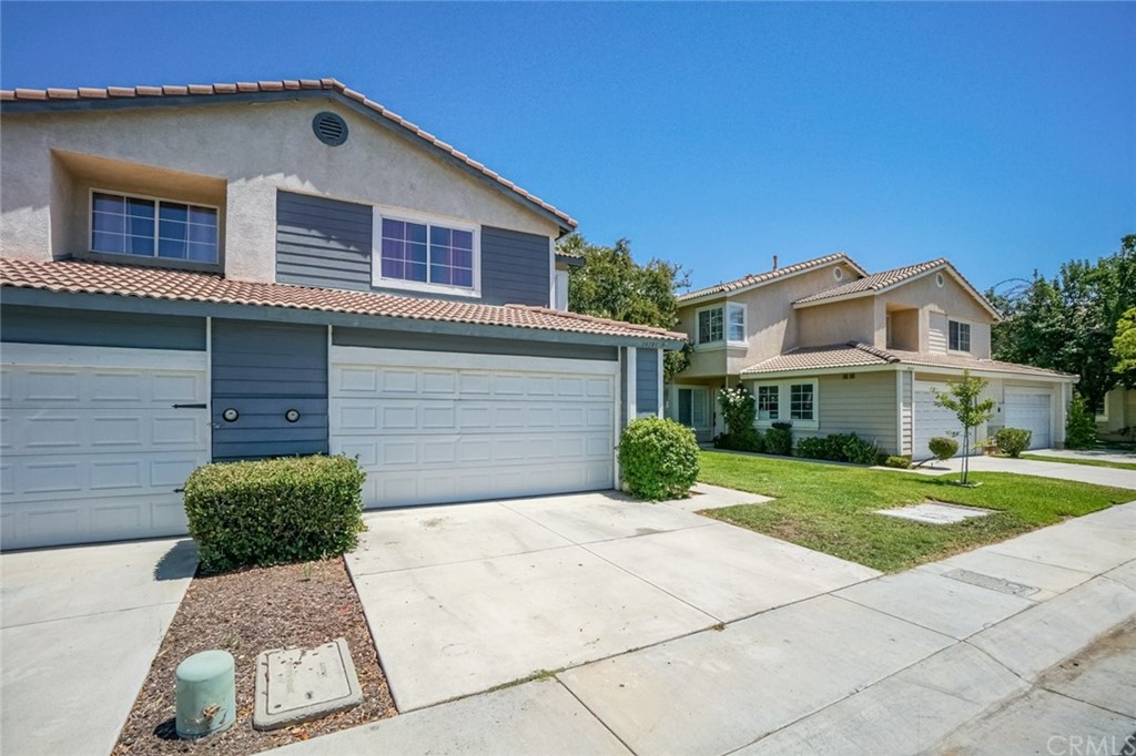 19195 Pemberton Place Riverside, CA 92508 - Photo 1 of 1 a front view of a house with a yard and garage