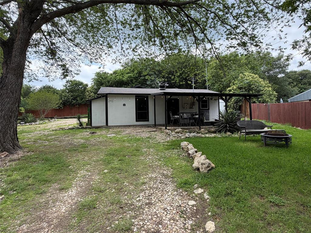 111 Apache Trail Whitney, TX 76692 - Photo 35 of 40 a front view of house with garden and trees
