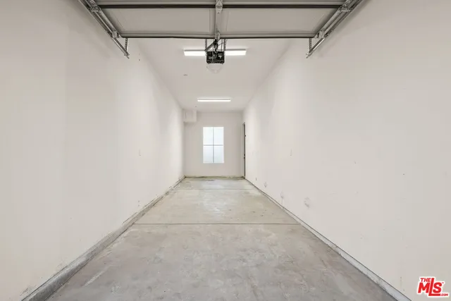a view of a room with a white walls