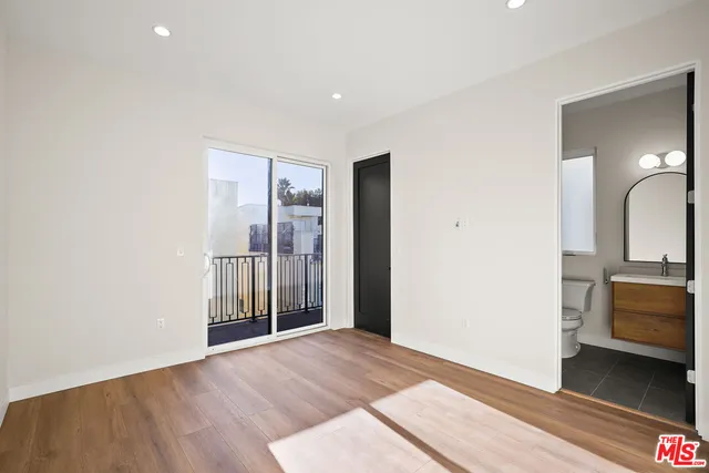 a view of a bedroom from the hallway