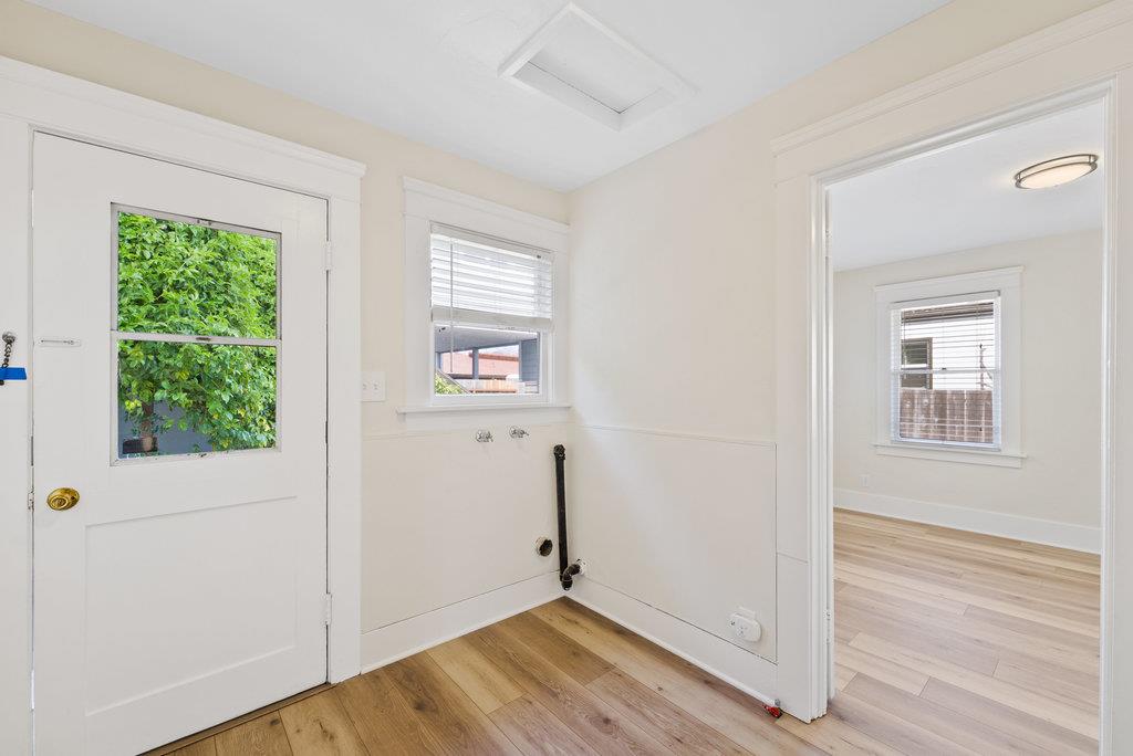 219-a Leonard Street Santa Cruz, CA 95060 - Photo 12 of 32 a view of an empty room with wooden floor and a window