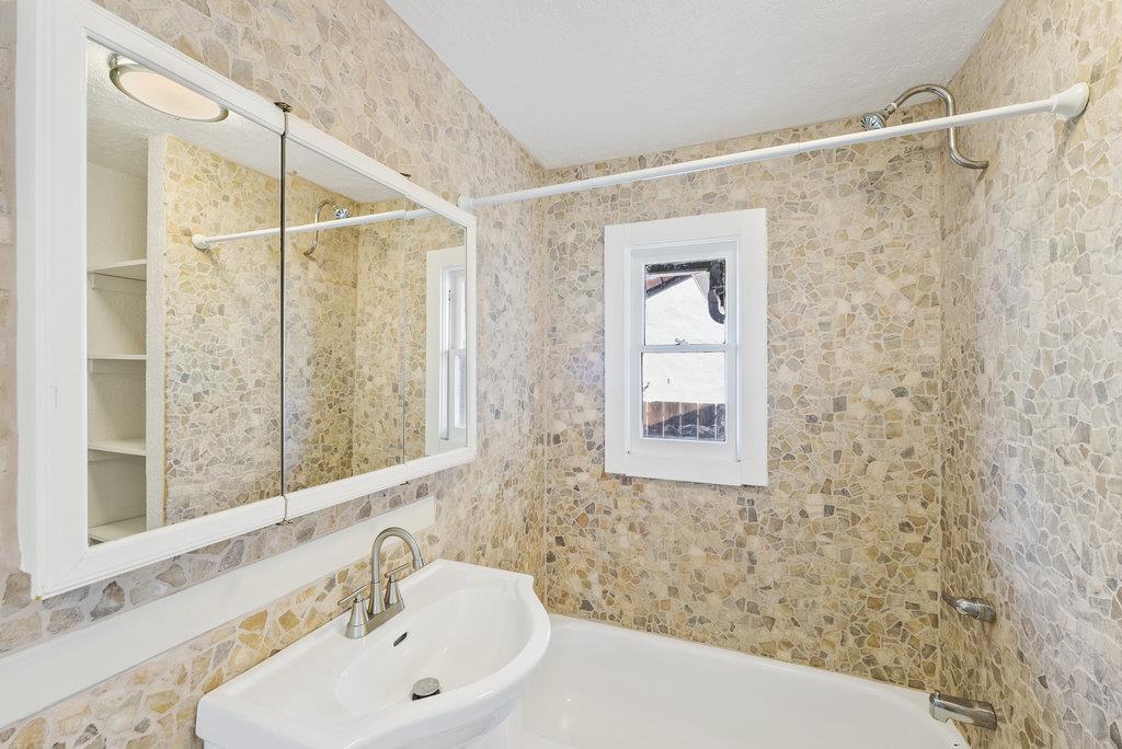 219-a Leonard Street Santa Cruz, CA 95060 - Photo 16 of 32 a bathroom with a sink and a mirror