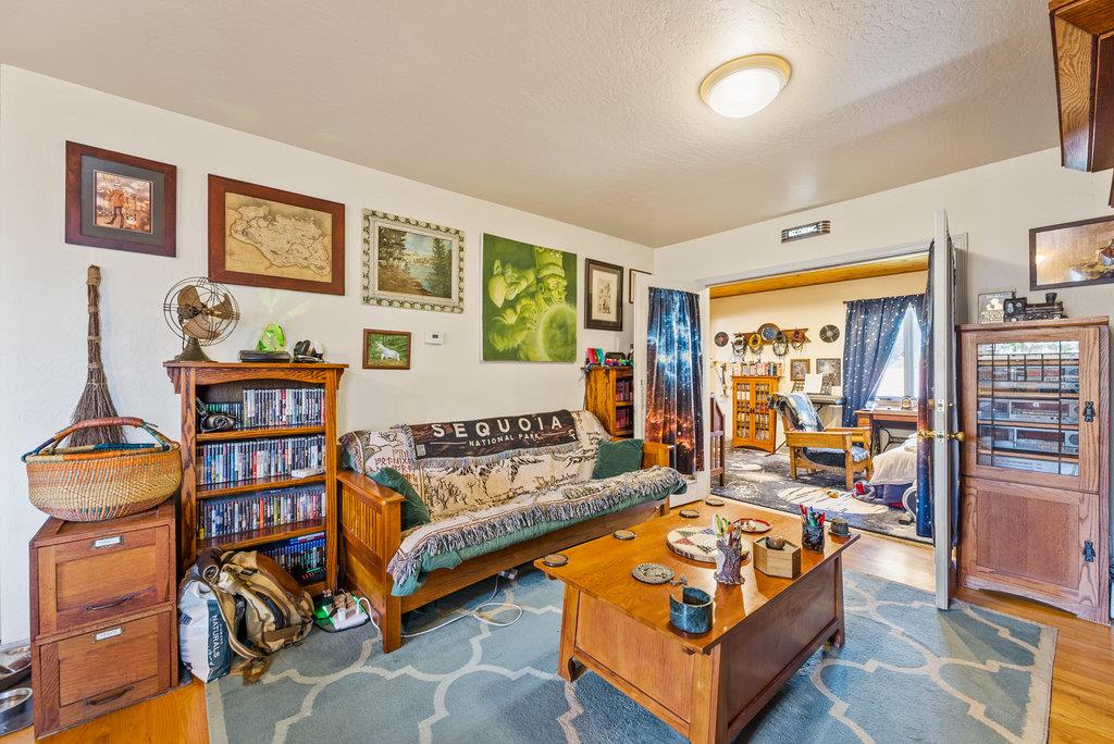 219-a Leonard Street Santa Cruz, CA 95060 - Photo 21 of 32 a bedroom with furniture and a book shelf
