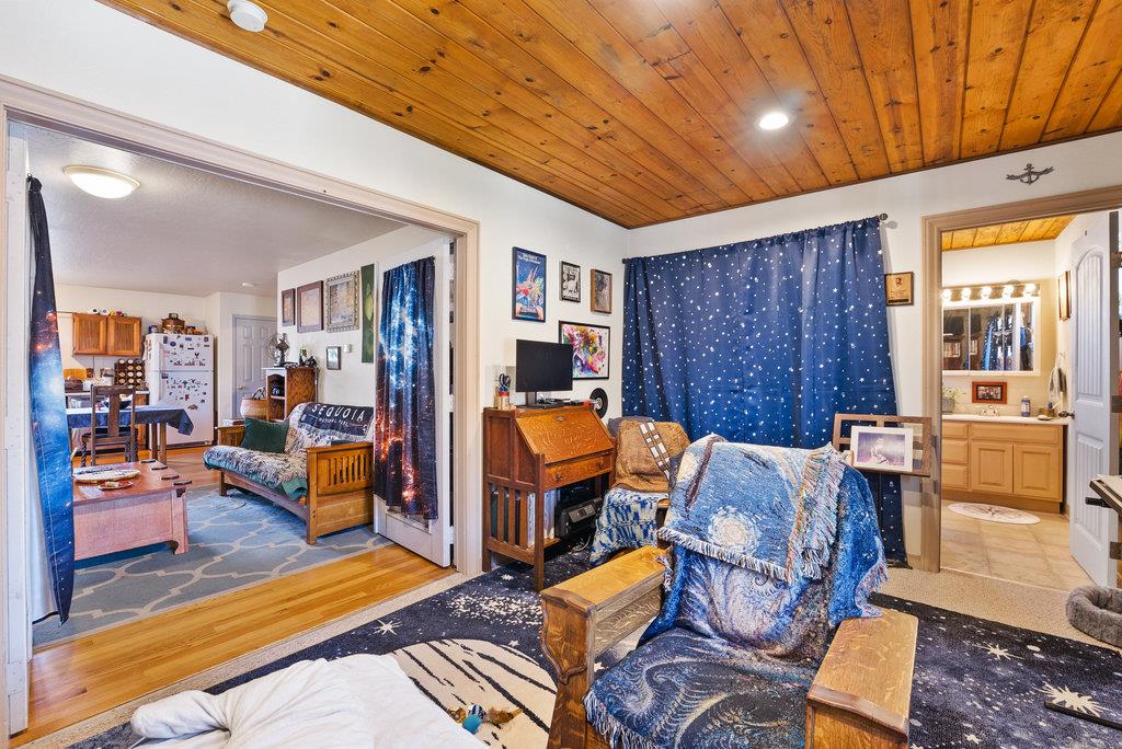 219-a Leonard Street Santa Cruz, CA 95060 - Photo 22 of 32 a living room with patio furniture and a dining table