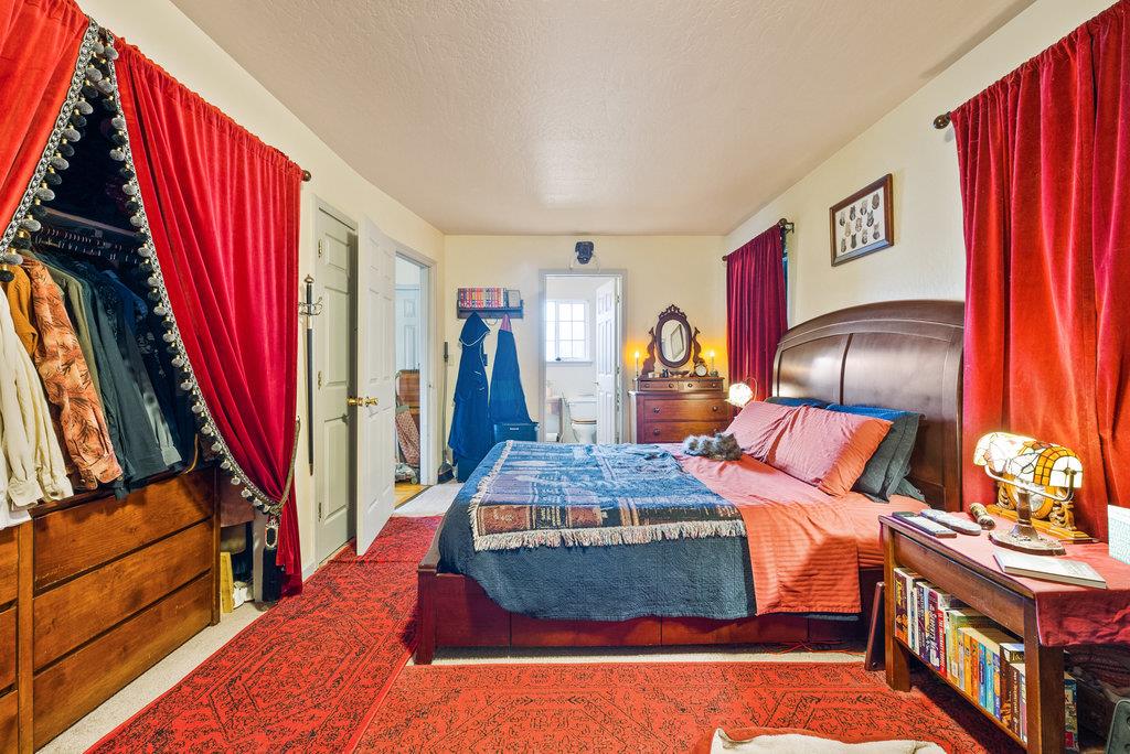 219-a Leonard Street Santa Cruz, CA 95060 - Photo 23 of 32 a bedroom with a large bed and a dresser