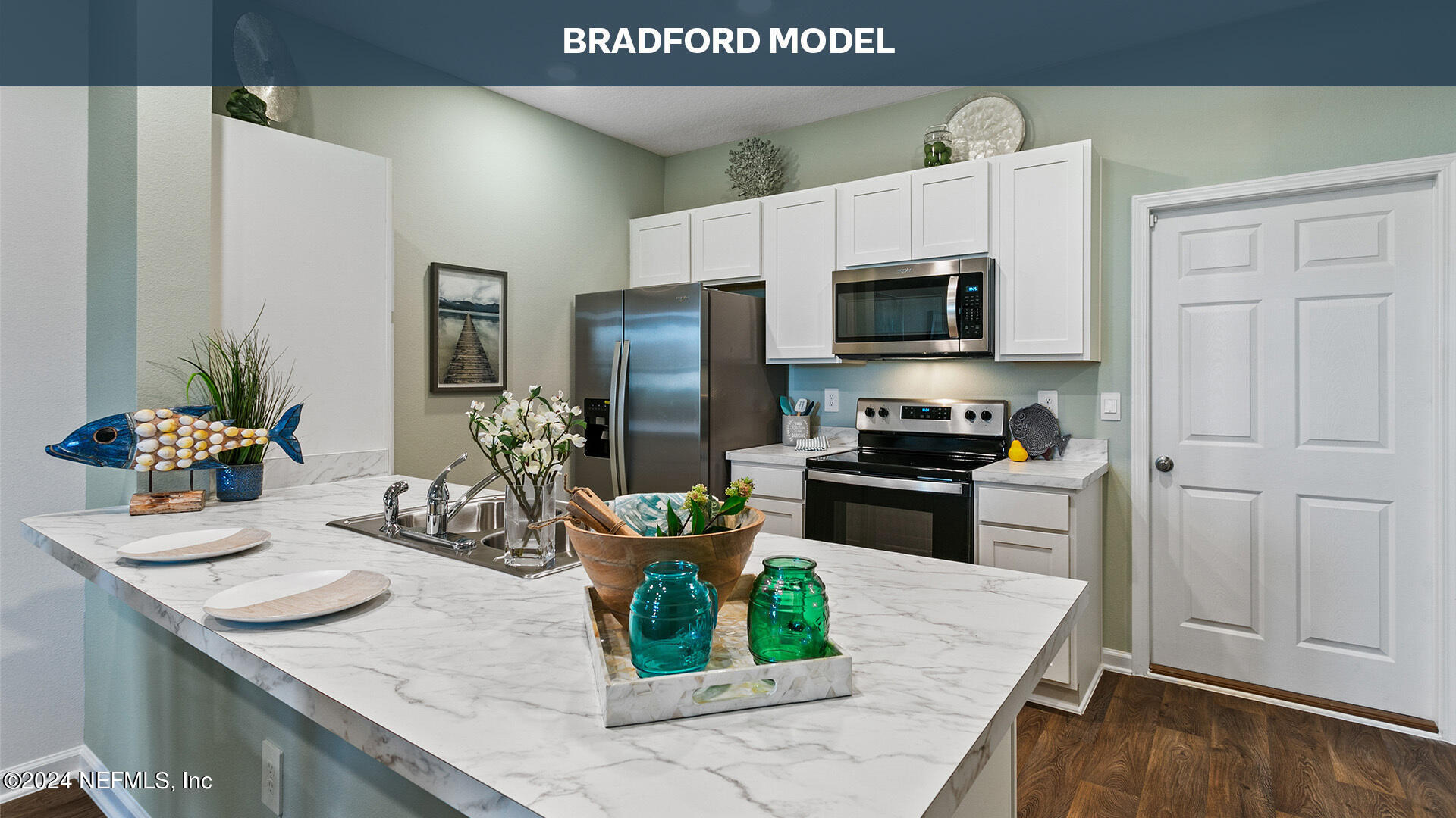 3523 Prairie Wind Court Middleburg, FL 32068 - Photo 9 of 30 a kitchen with a sink a stove and refrigerator