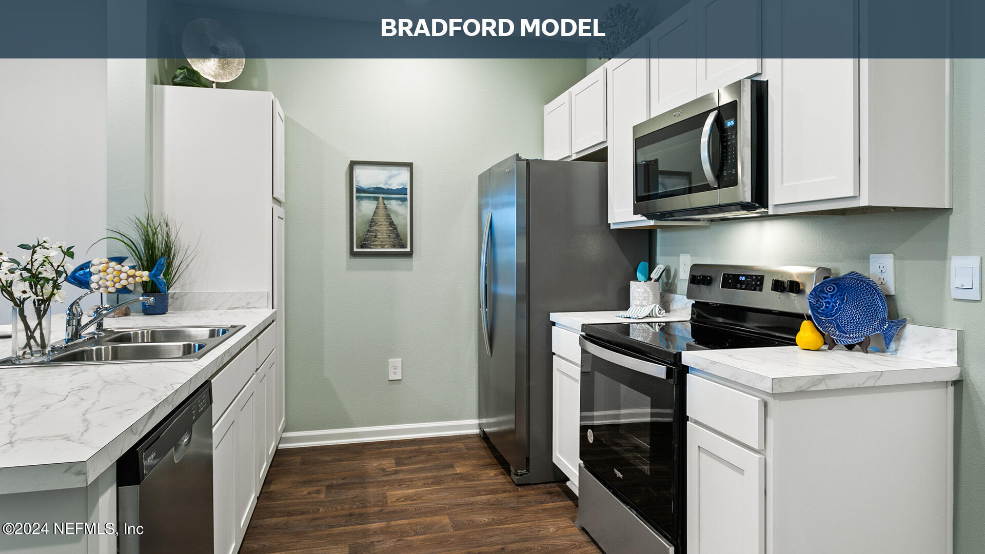 3523 Prairie Wind Court Middleburg, FL 32068 - Photo 10 of 30 a kitchen with stainless steel appliances granite countertop a refrigerator stove and microwave