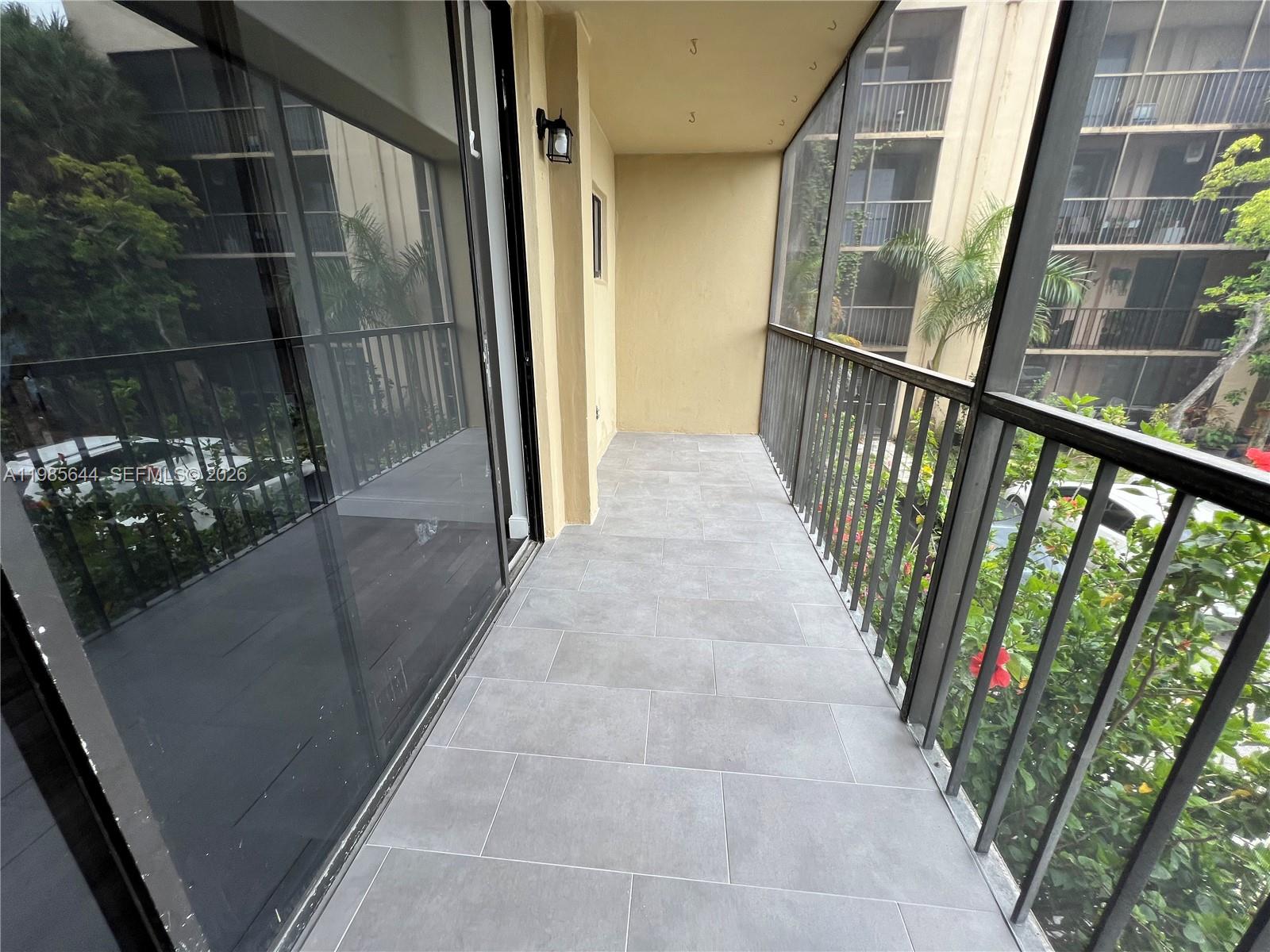 8635 Northwest 8th Street, Unit 211 Miami, FL 33126 - Photo 16 of 17 a view of a balcony