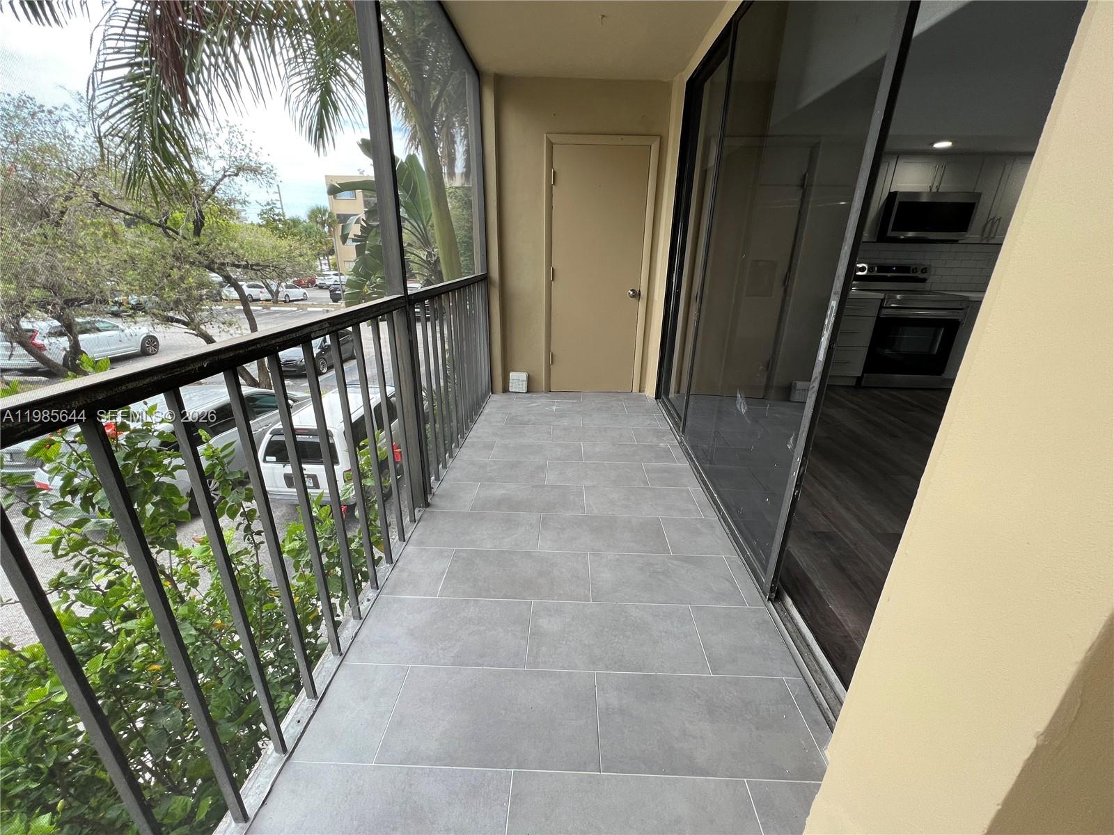 8635 Northwest 8th Street, Unit 211 Miami, FL 33126 - Photo 17 of 17 a view of a balcony
