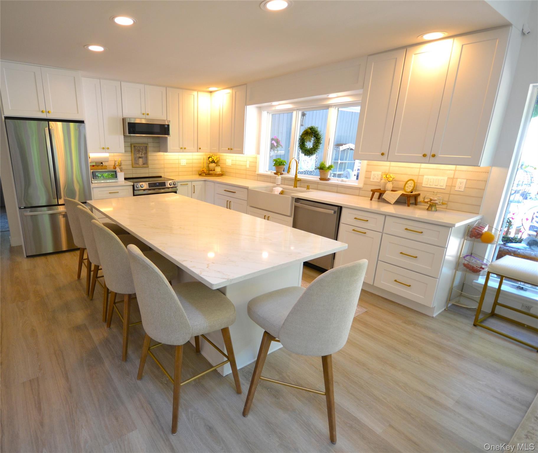 266 Shear Hill Road Mahopac, NY 10541 - Photo 3 of 34 a kitchen with stainless steel appliances granite countertop a table chairs sink refrigerator and cabinets