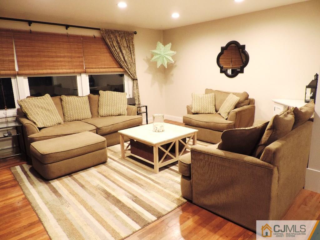 27 Columbia Road Old Bridge, NJ 08859 - Photo 2 of 24 a living room with furniture and a rug