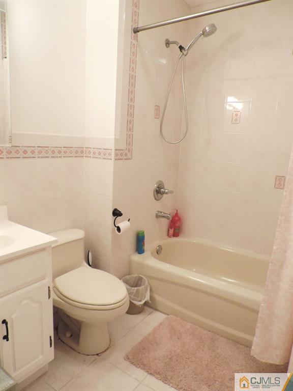 27 Columbia Road Old Bridge, NJ 08859 - Photo 13 of 24 a white toilet sitting next to a bath tub and shower