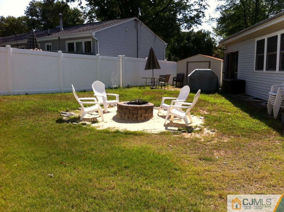 27 Columbia Road Old Bridge, NJ 08859 - Photo 24 of 24 a front view of a house with a garden and patio