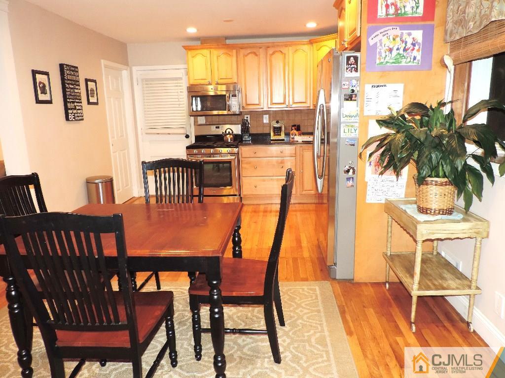 27 Columbia Road Old Bridge, NJ 08859 - Photo 4 of 24 a view of a dining room with furniture and a potted plant