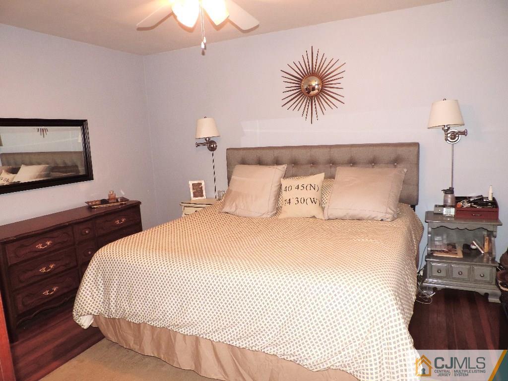 27 Columbia Road Old Bridge, NJ 08859 - Photo 8 of 24 a bedroom with a bed and a flat screen tv