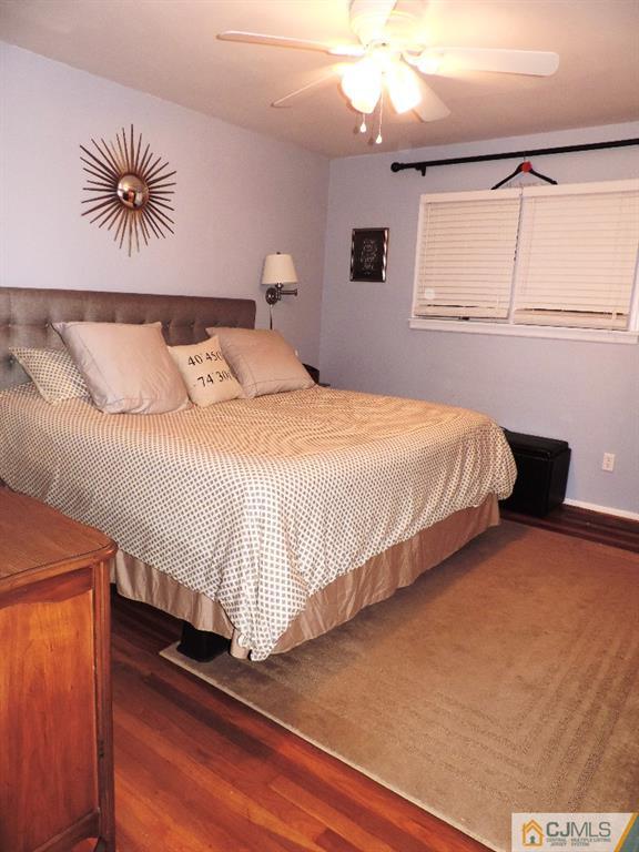 27 Columbia Road Old Bridge, NJ 08859 - Photo 9 of 24 a bedroom with a large bed and a chandelier