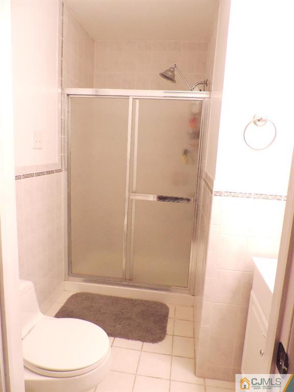 27 Columbia Road Old Bridge, NJ 08859 - Photo 10 of 24 a bathroom with a shower and a toilet