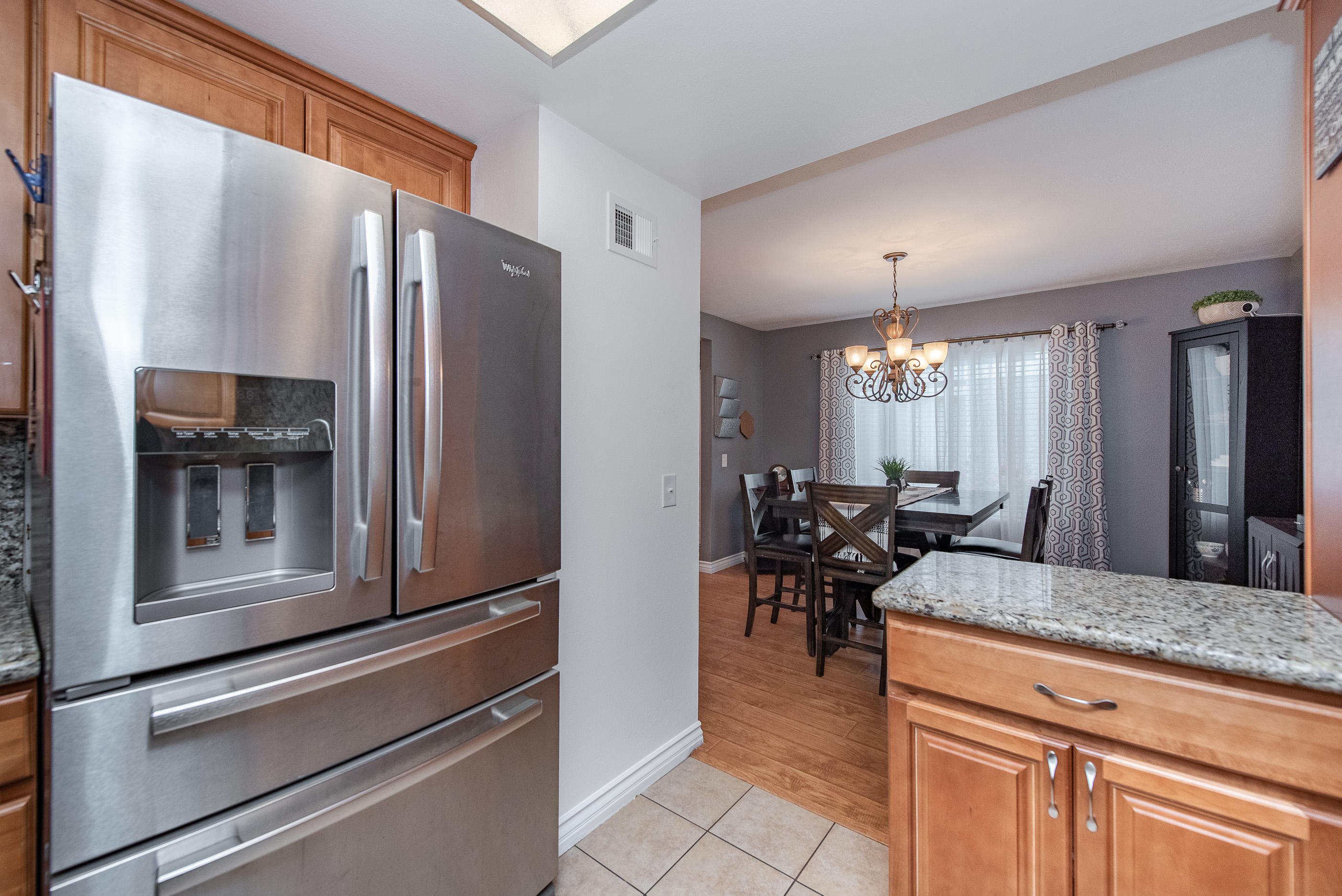 552 Spring Road, Unit 87 Moorpark, CA 93021 - Photo 13 of 29 a kitchen with sink refrigerator and dining table