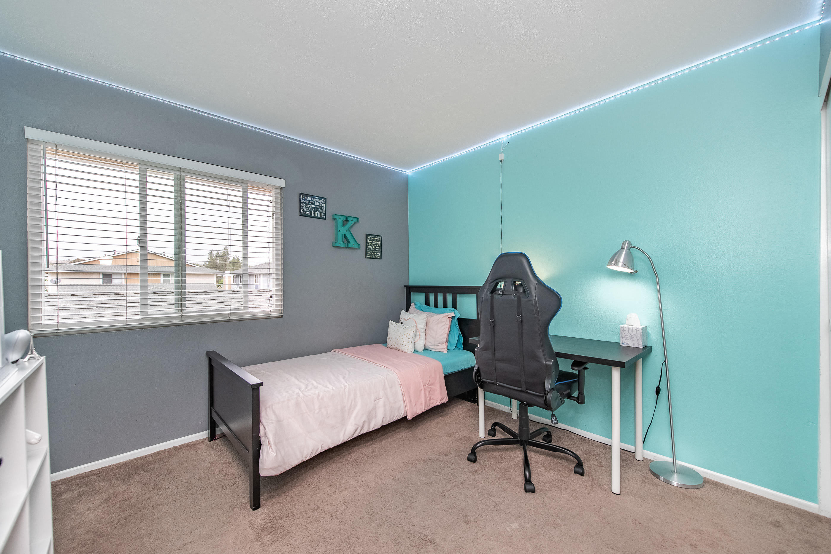552 Spring Road, Unit 87 Moorpark, CA 93021 - Photo 17 of 29 a bedroom with a bed chair and window