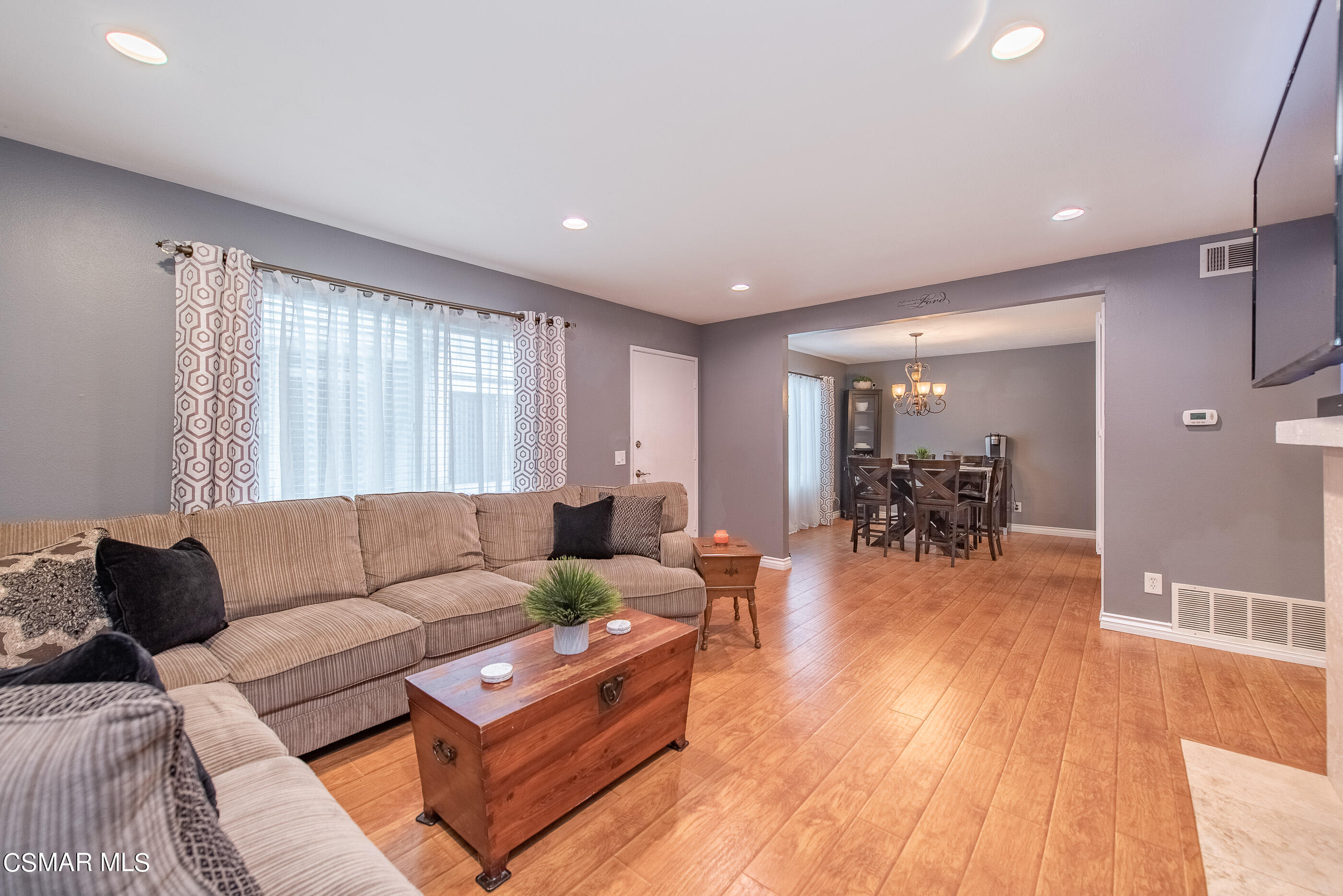 552 Spring Road, Unit 87 Moorpark, CA 93021 - Photo 6 of 29 a living room with furniture and wooden floor