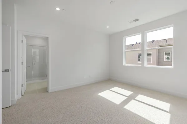 a view of empty room with windows