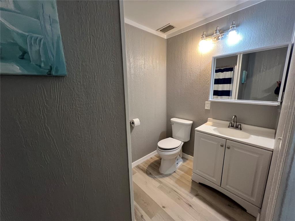 8806 Southwest Start Center Street Arcadia, FL 34269 - Photo 18 of 21 a bathroom with a toilet sink and mirror