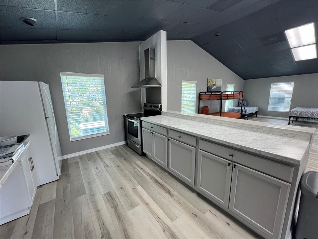 8806 Southwest Start Center Street Arcadia, FL 34269 - Photo 5 of 21 a kitchen with stainless steel appliances granite countertop a sink stove and cabinets