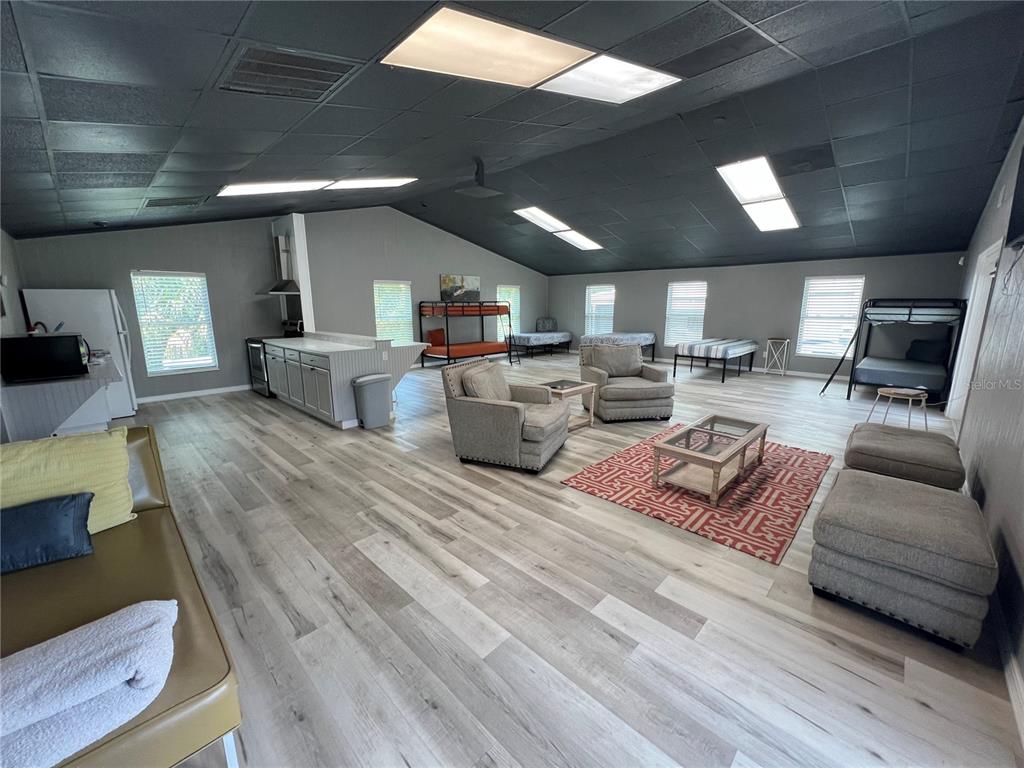 8806 Southwest Start Center Street Arcadia, FL 34269 - Photo 8 of 21 a living room with furniture and a wooden floor