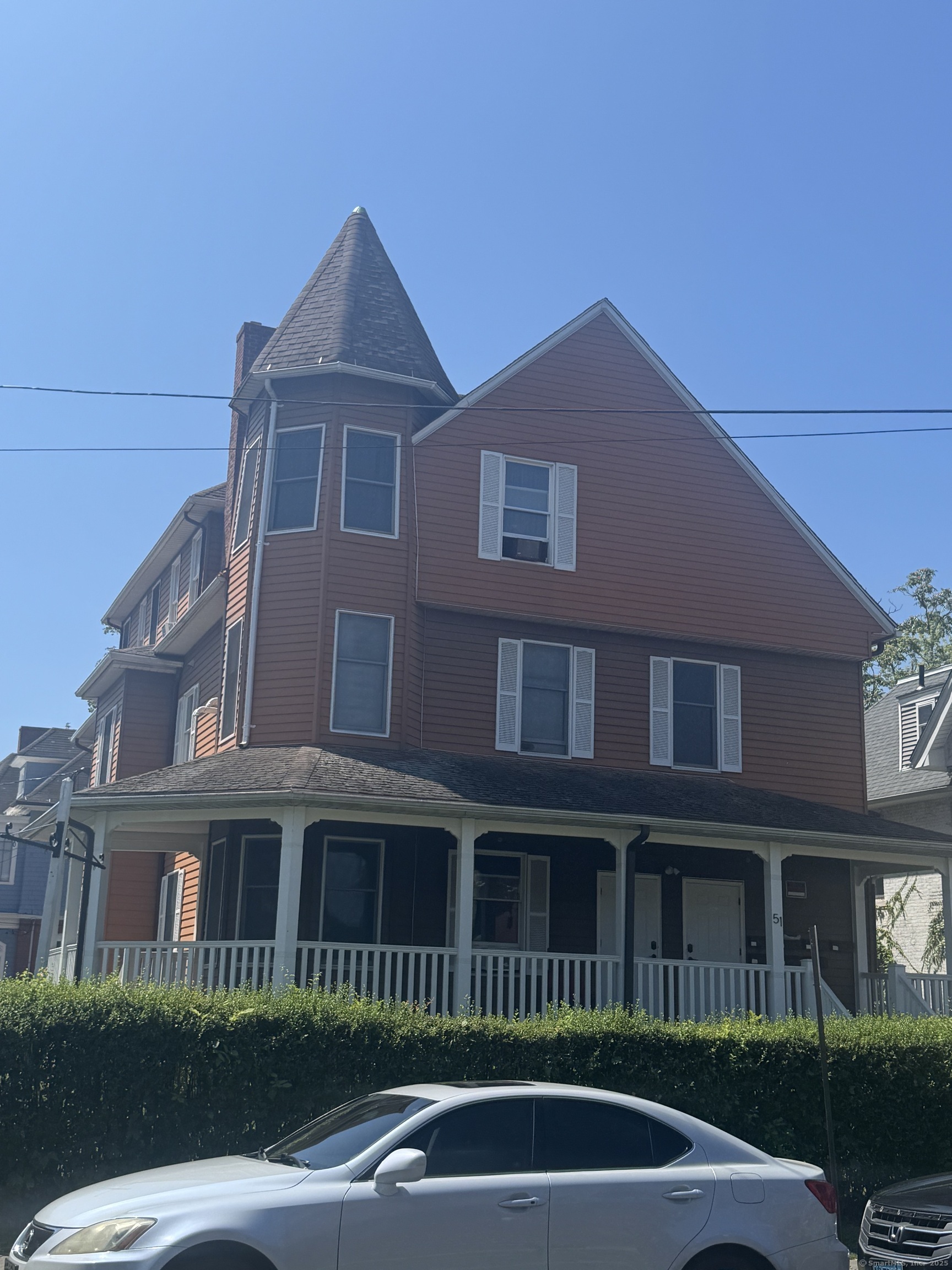 51 Russ Street, Unit 51D Hartford, CT 06106 - Photo 1 of 5 a front view of a house with a yard
