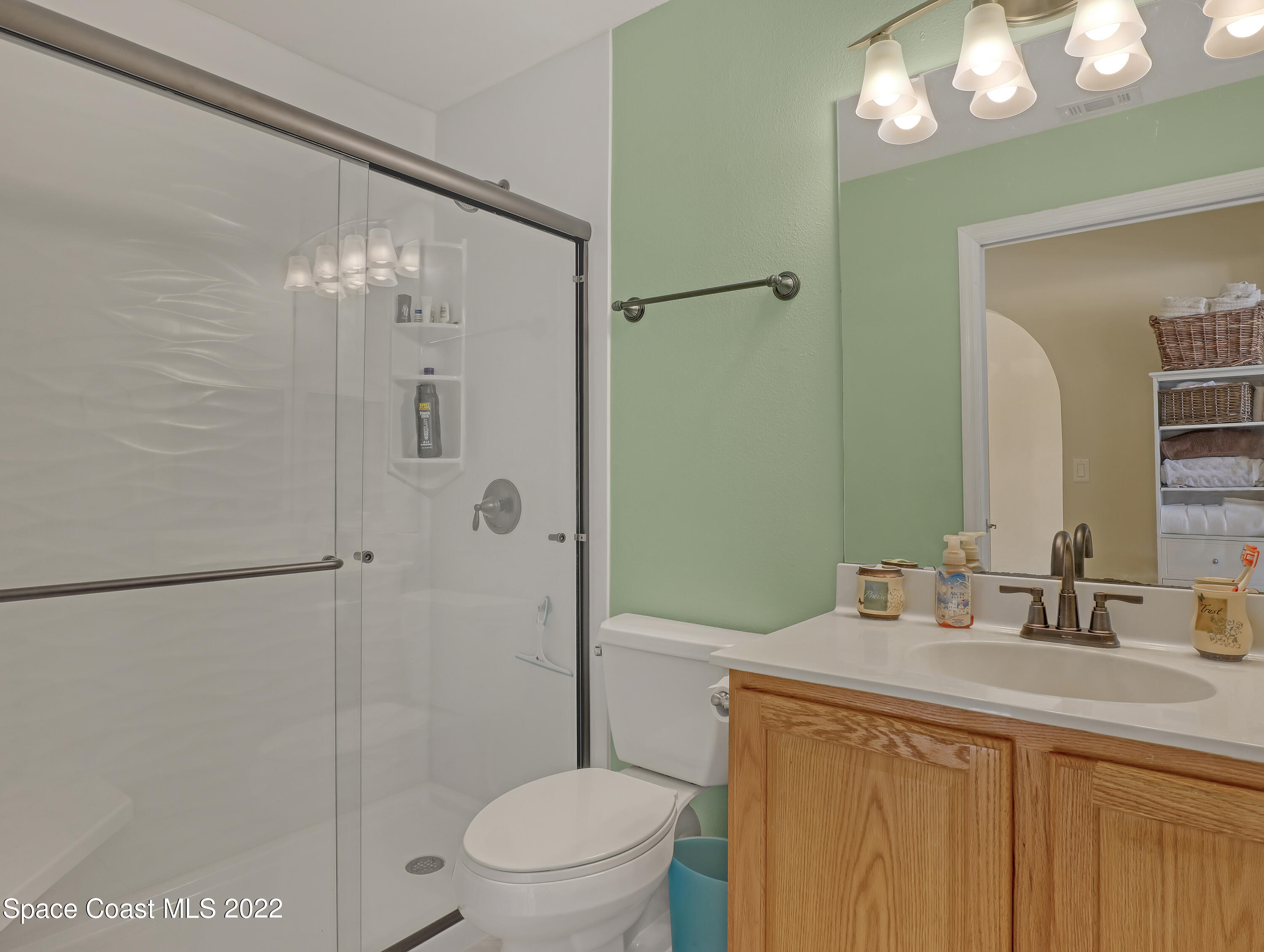 3935 Orion Way Rockledge, FL 32955 - Photo 24 of 30 a bathroom with a sink a toilet and shower