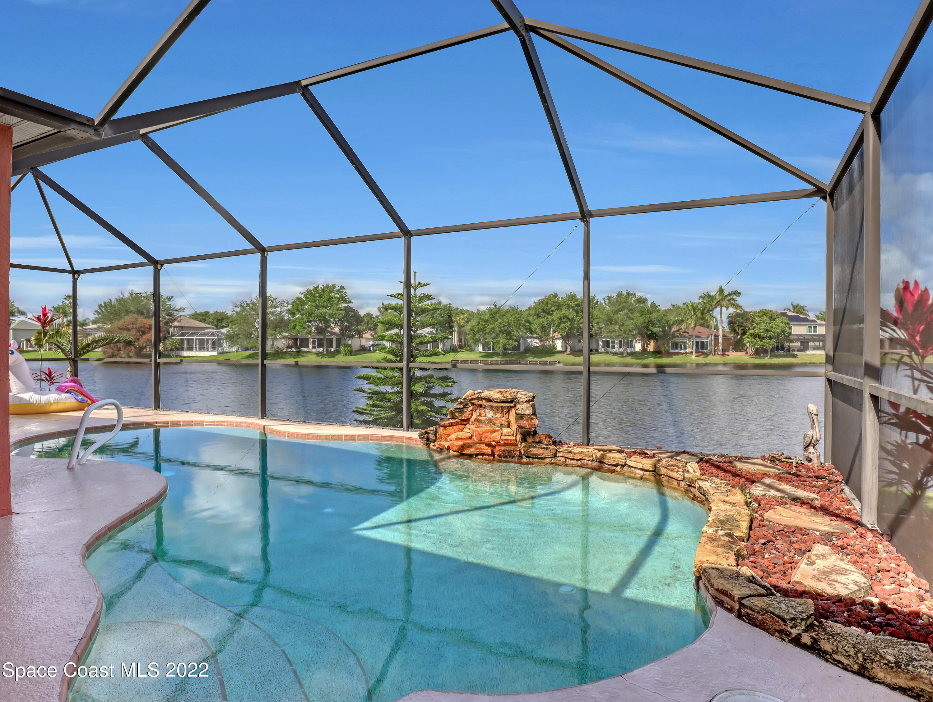3935 Orion Way Rockledge, FL 32955 - Photo 28 of 30 a backyard of a house with outdoor seating