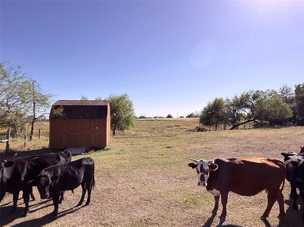 601 St Teague Tx 75860 Teague, TX 75860 - Photo 11 of 13 a view of a lake with furniture and city view