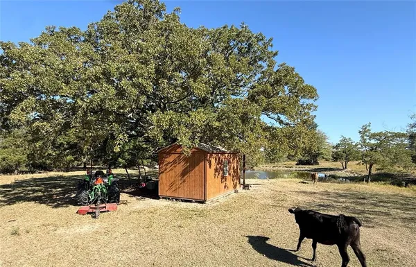 a view of a lake with furniture and city view