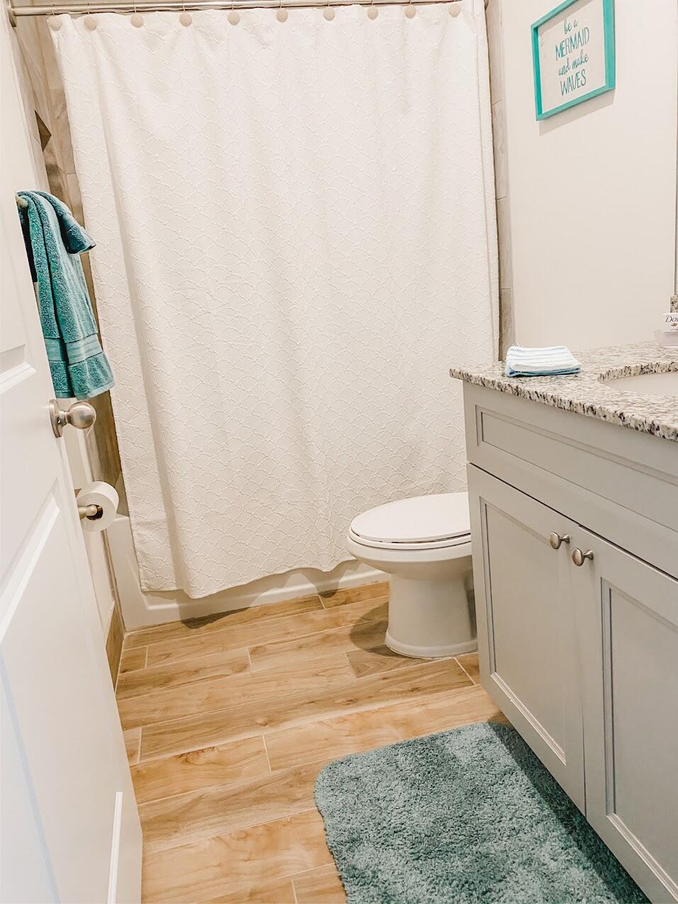 103 Osprey Circle Hypoluxo, FL 33462 - Photo 6 of 27 a bathroom with a sink and a toilet