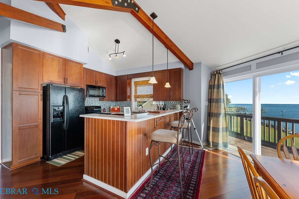 24 River Road Lottsburg, VA 22511 - Photo 27 of 35 a kitchen with stainless steel appliances granite countertop a refrigerator a sink and a stove