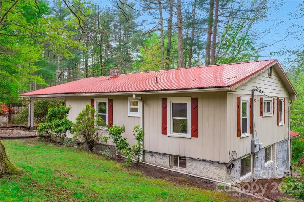 62 Kinard Lane Penrose, NC 28766 - Photo 1 of 25 a front view of a house with garden