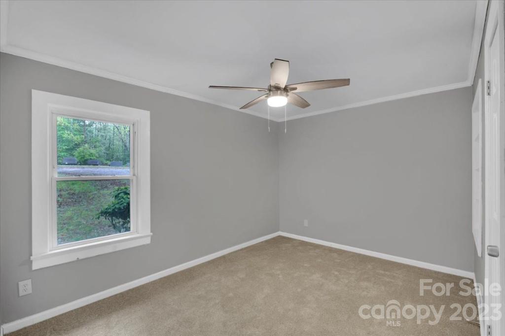 62 Kinard Lane Penrose, NC 28766 - Photo 11 of 25 an empty room with a window